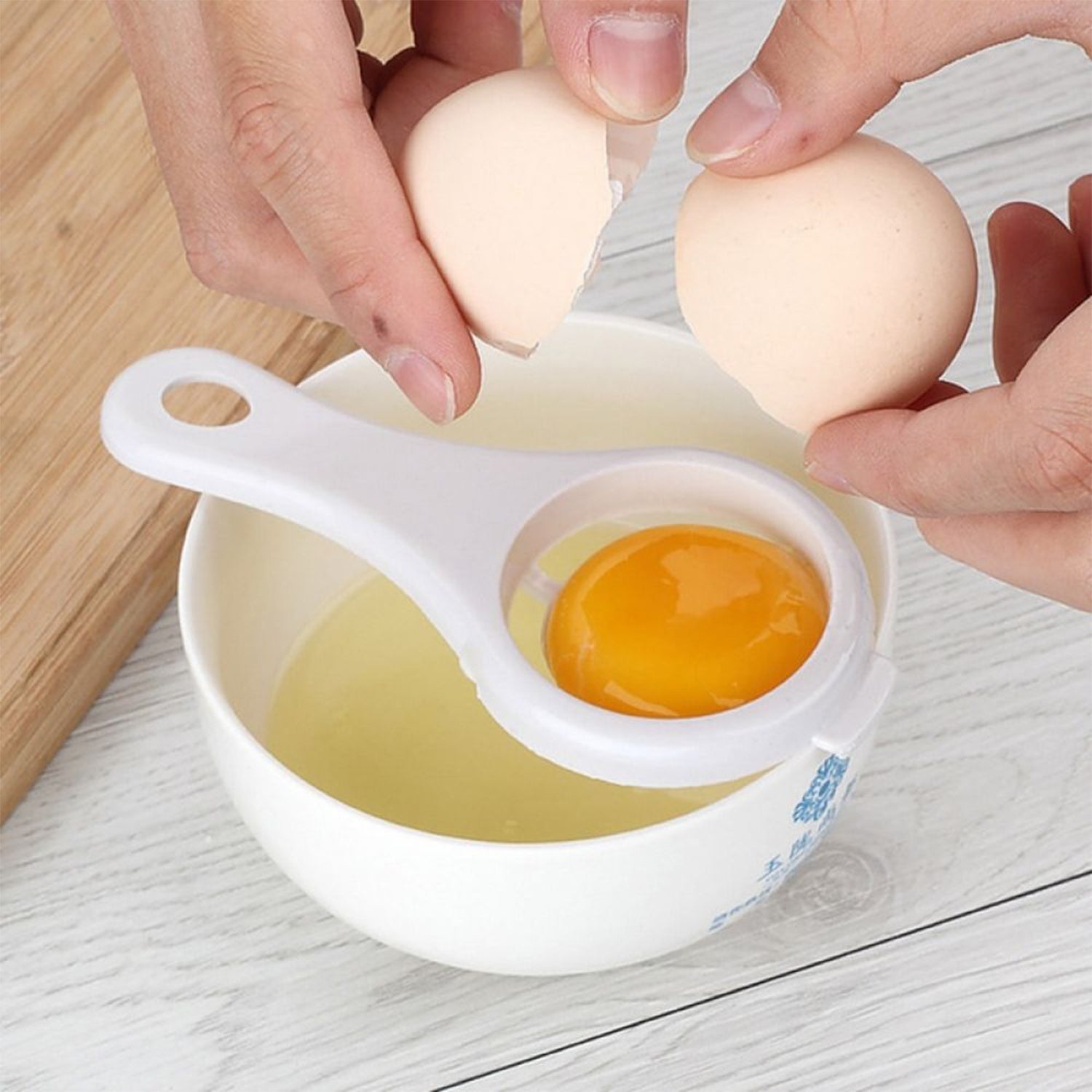 Your Brand egg yolk separator in use, separating yolk from whites for easy cooking