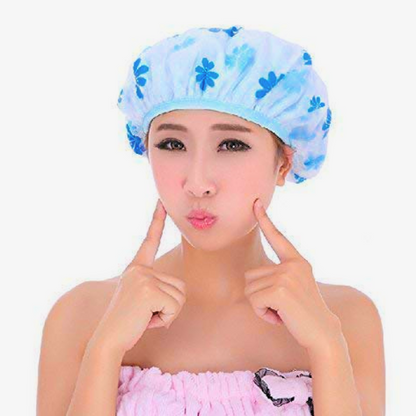 Woman wearing a blue floral elastic band shower cap for long hair protecting hair during shower