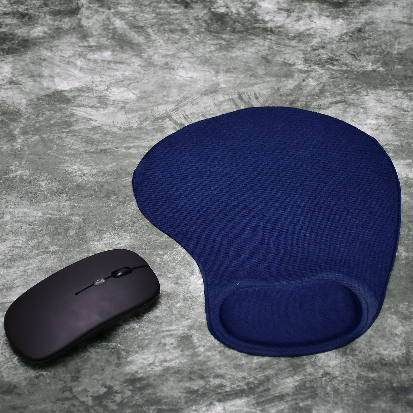 Comfortable ergonomic wrist mouse pad in navy blue with a matching black computer mouse