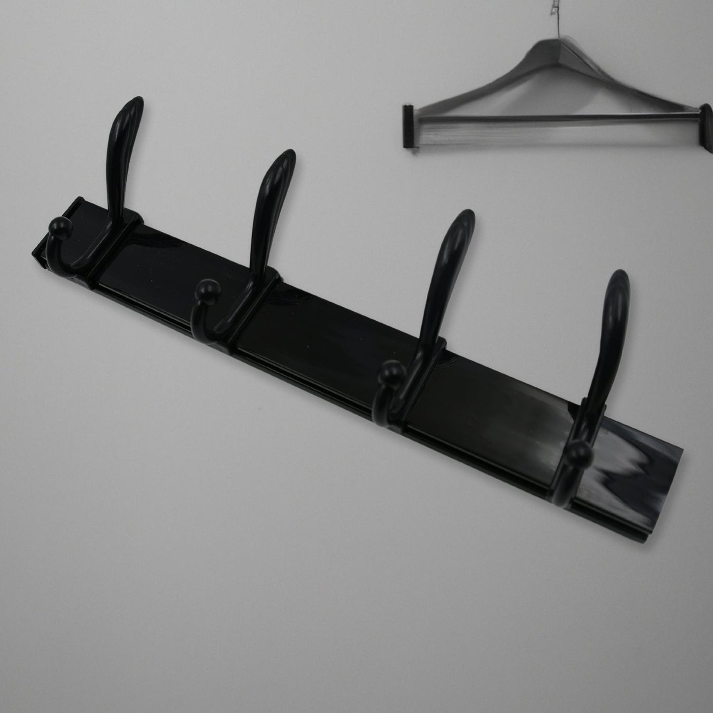 Extra long wall coat hanger in sleek black design with multiple hooks for efficient storage