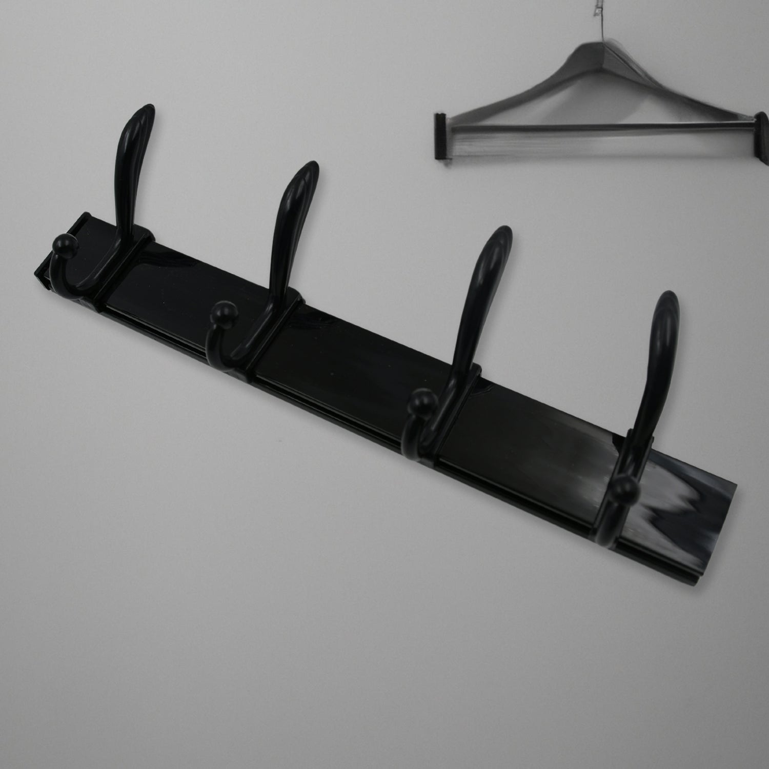 Extra long wall coat hanger in sleek black design with multiple hooks for efficient storage