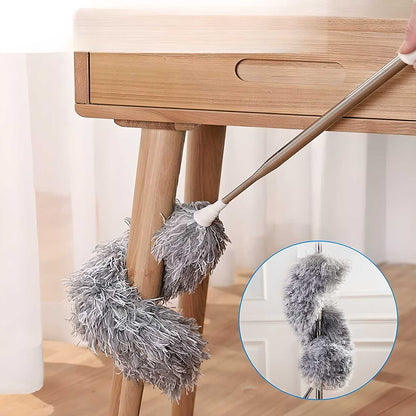 Flexible mop duster from THE GIR FARMER cleaning wooden table legs with soft gray microfiber fibers