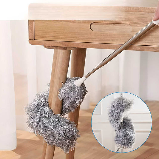 Flexible mop duster from THE GIR FARMER cleaning wooden table legs with soft gray microfiber fibers