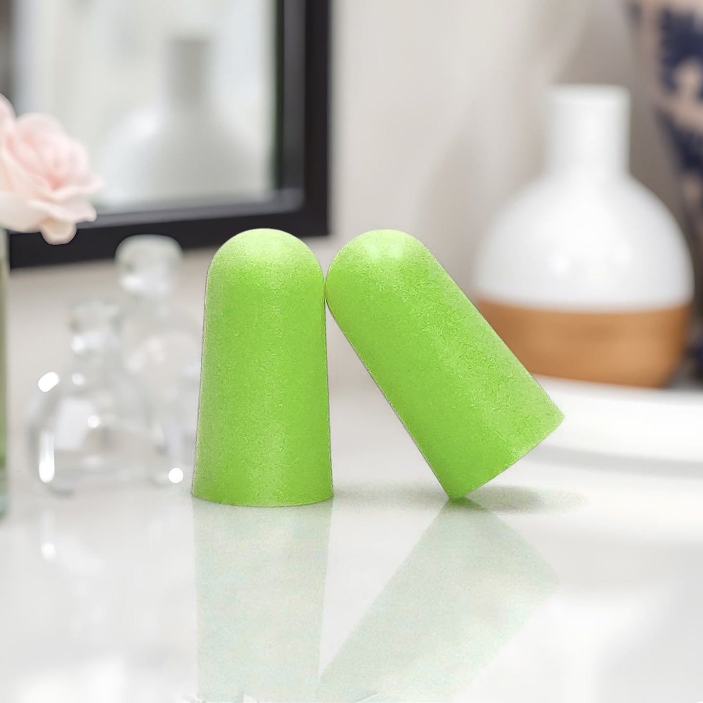 Green foam earplugs for noise reduction perfect for sleeping and loud environments