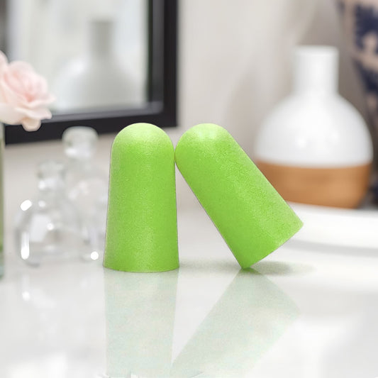 Green foam earplugs for noise reduction perfect for sleeping and loud environments
