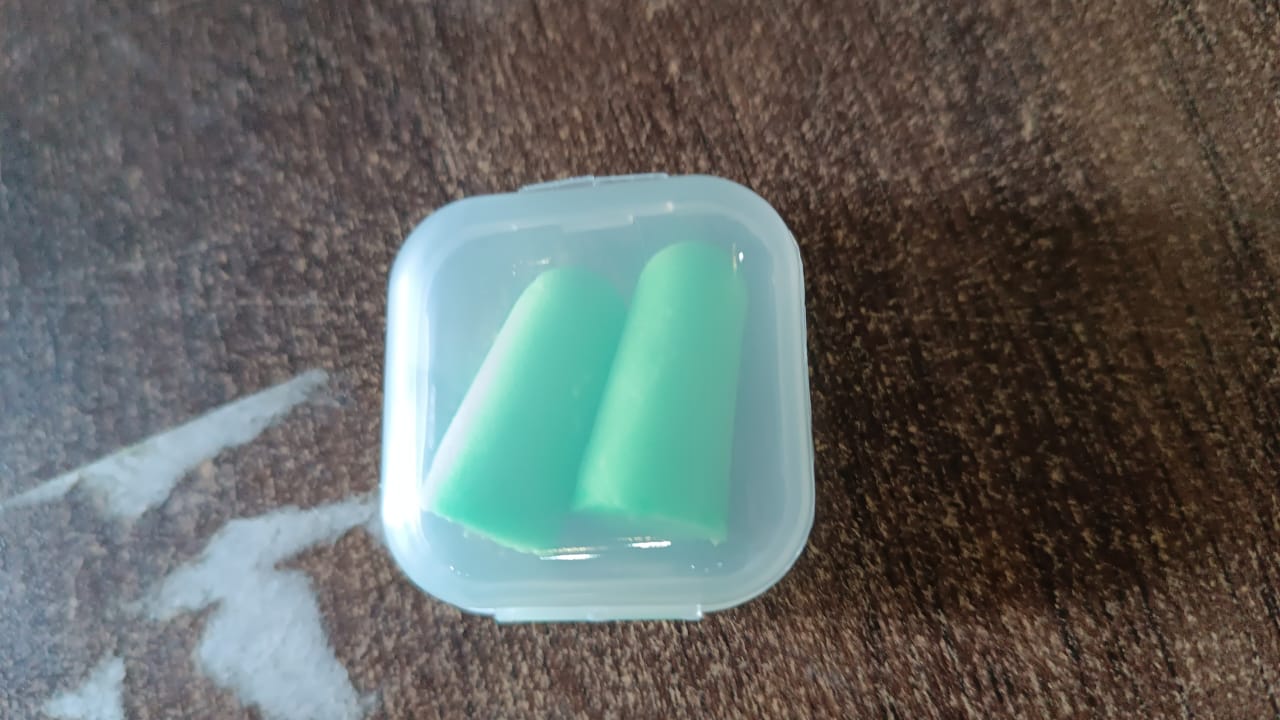 Your Brand foam earplugs for noise reduction in a clear storage case for easy portability