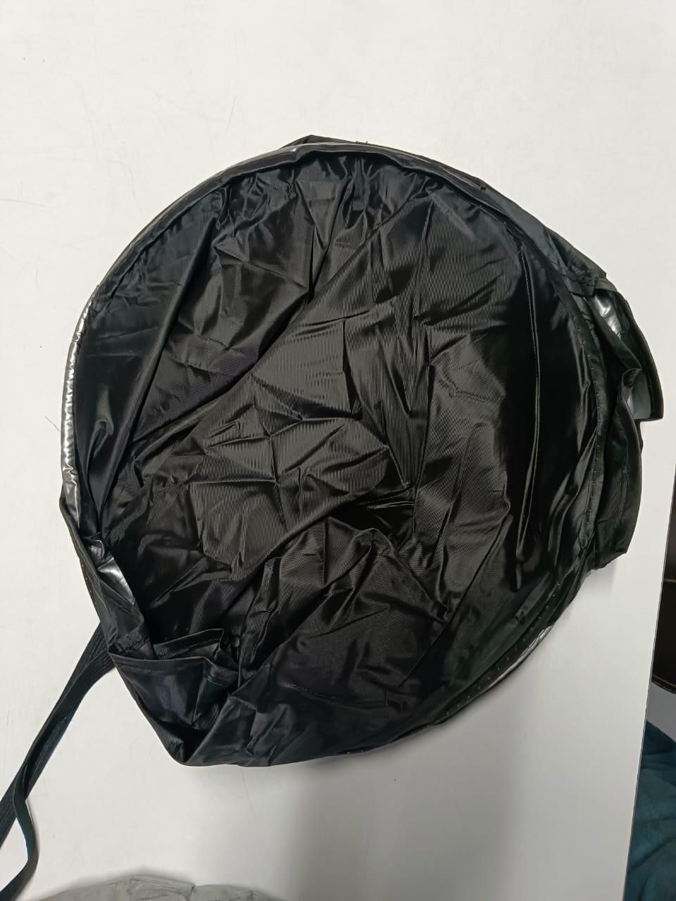 Compact folding car window sunshade storage bag with durable black fabric for easy transportation
