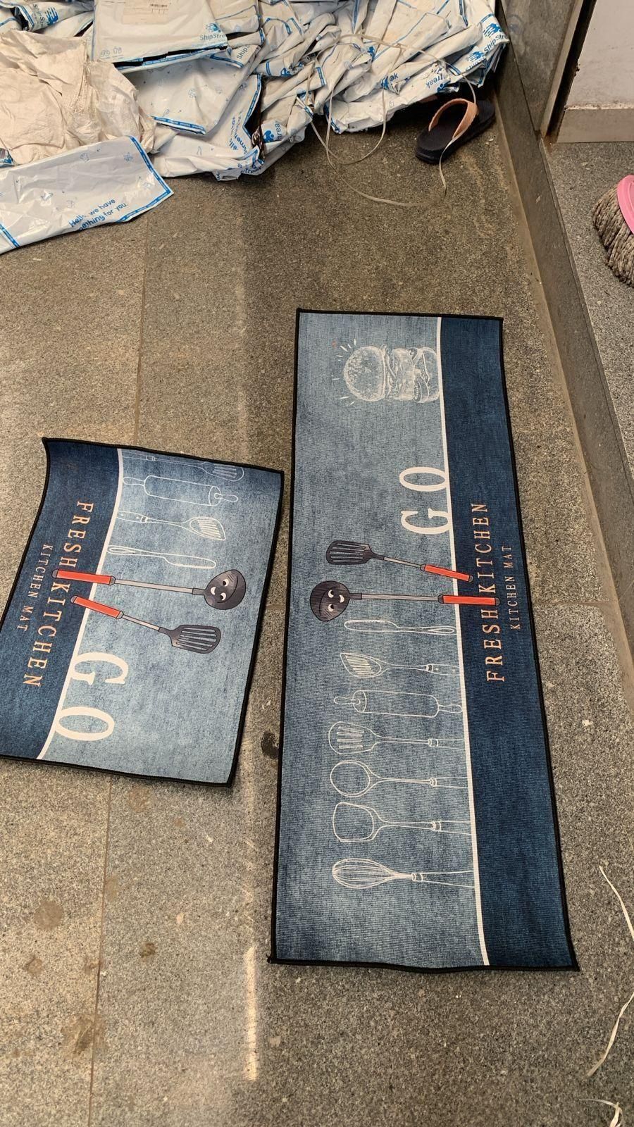THE GIR FARMER rubber floor mat with geometric pattern featuring kitchen utensil designs in blue and black tones