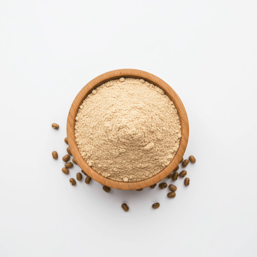 The Gir Farmer garbanzo bean flour in a wooden bowl with raw beans around for gluten-free cooking