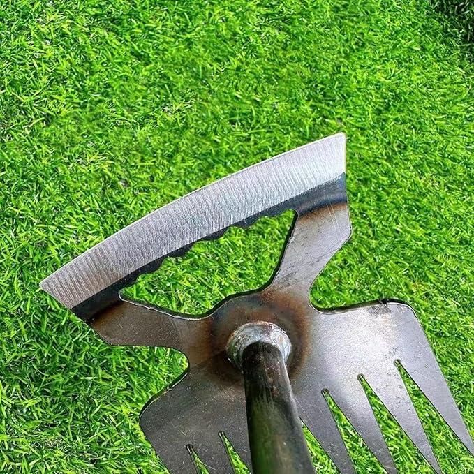 Multi function shovel for home gardens with sharp blade and sturdy metal prongs on green grass