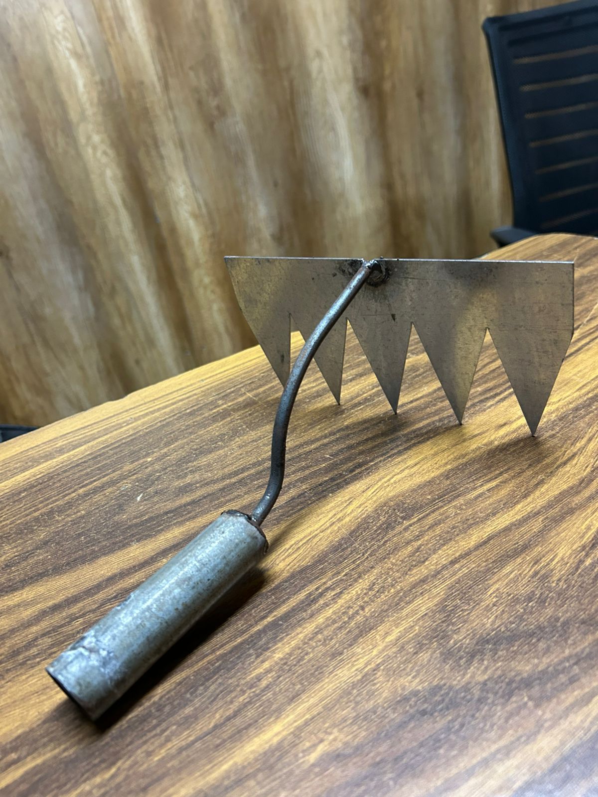 Metal Garden Weeding Tool with a serrated edge for effective weed removal in gardens