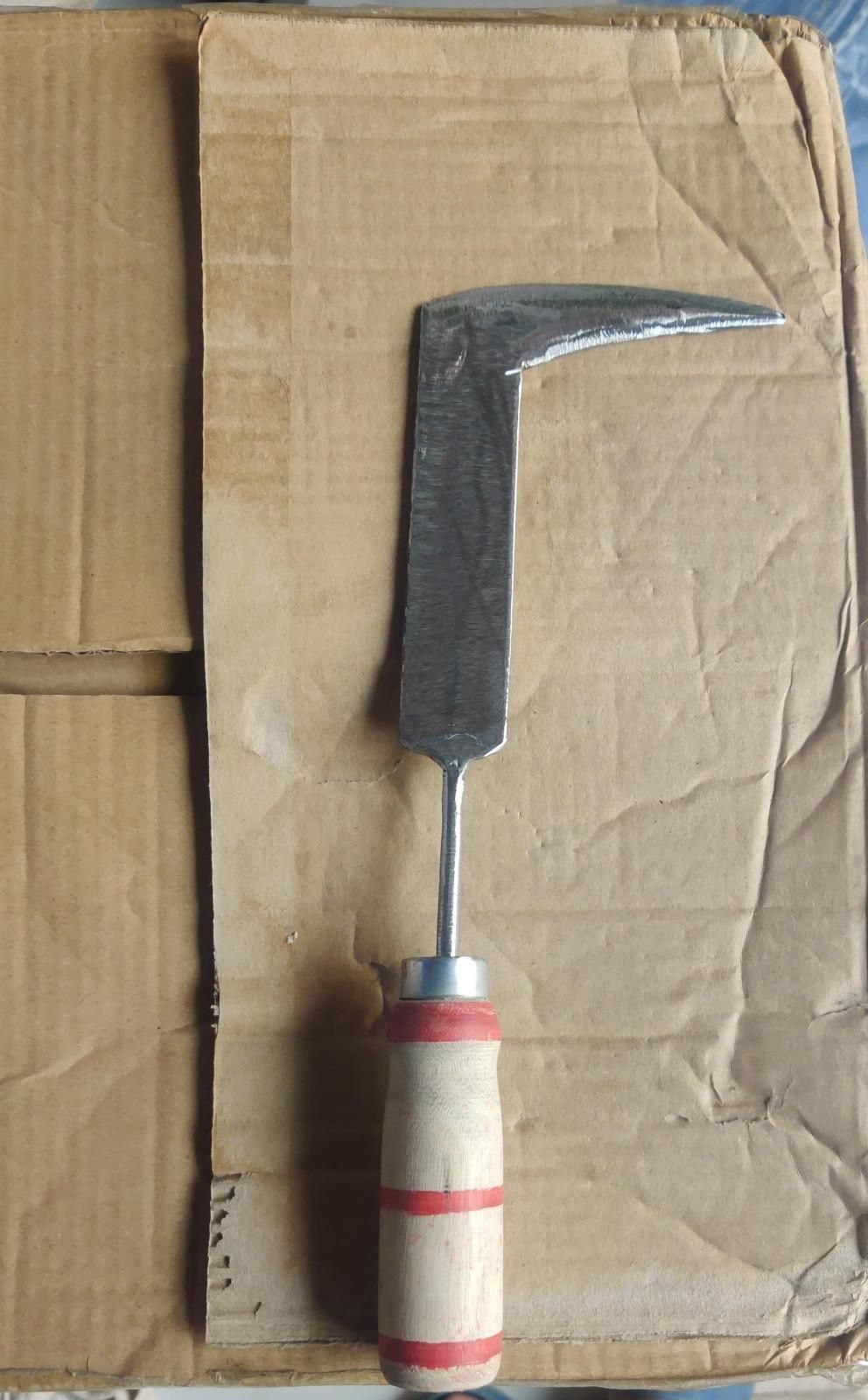 Rustic handheld weeding tool for gardens with steel L shaped hooked blade and wooden red striped handle for tight spaces