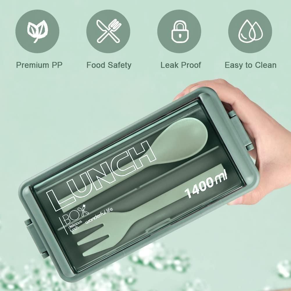 Hand holding green bento compartment lunch box with included spoon and fork, 1400ml capacity