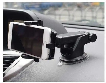 Black car mobile holder for dashboard with white smartphone securely mounted on car dashboard