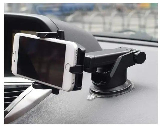 Black car mobile holder for dashboard with white smartphone securely mounted on car dashboard