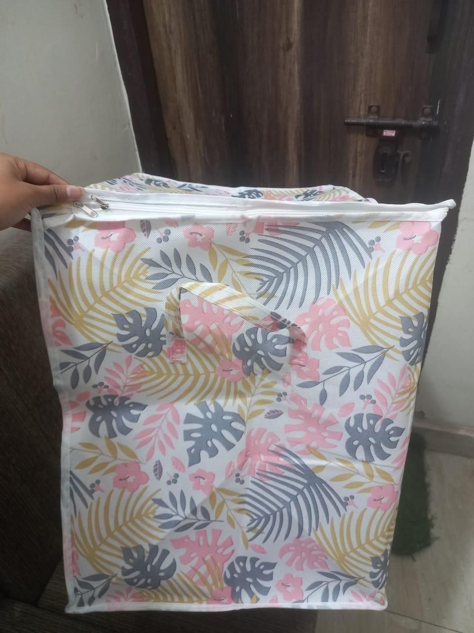 Portable laundry storage box with tropical leaf and flower pattern in pastel colors from THE GIR FARMER