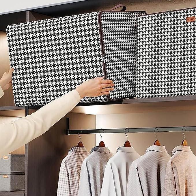 THE GIR FARMER portable laundry storage box in black and white houndstooth pattern being placed on a closet shelf
