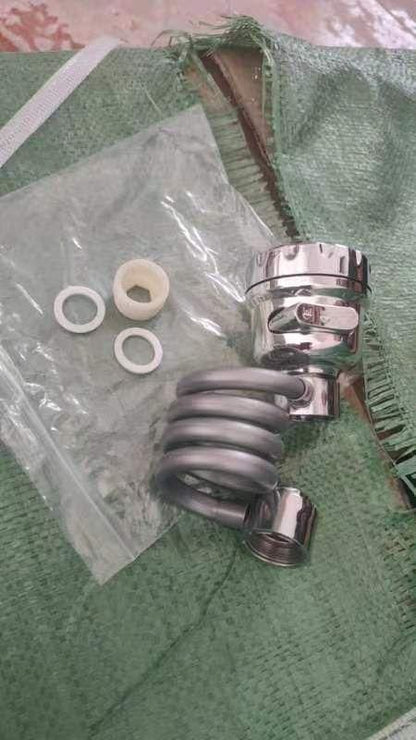 Chrome sink sprayer attachment for kitchen faucet with washers and plastic adapter on green cloth