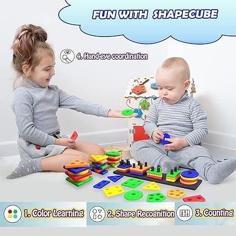 Children playing with geometric stacker shape sorter blocks for learning colors and shapes