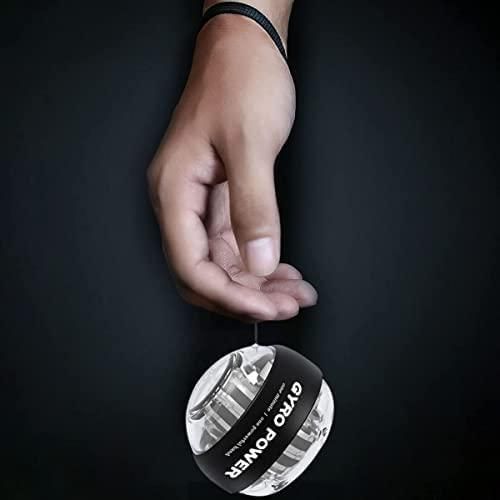 Hand holding a gyro wrist strengthener ball designed for enhancing grip and wrist strength.