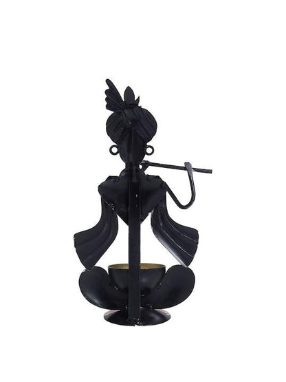Handcrafted Krishna statue for home depicting Krishna playing the flute in a black metal design