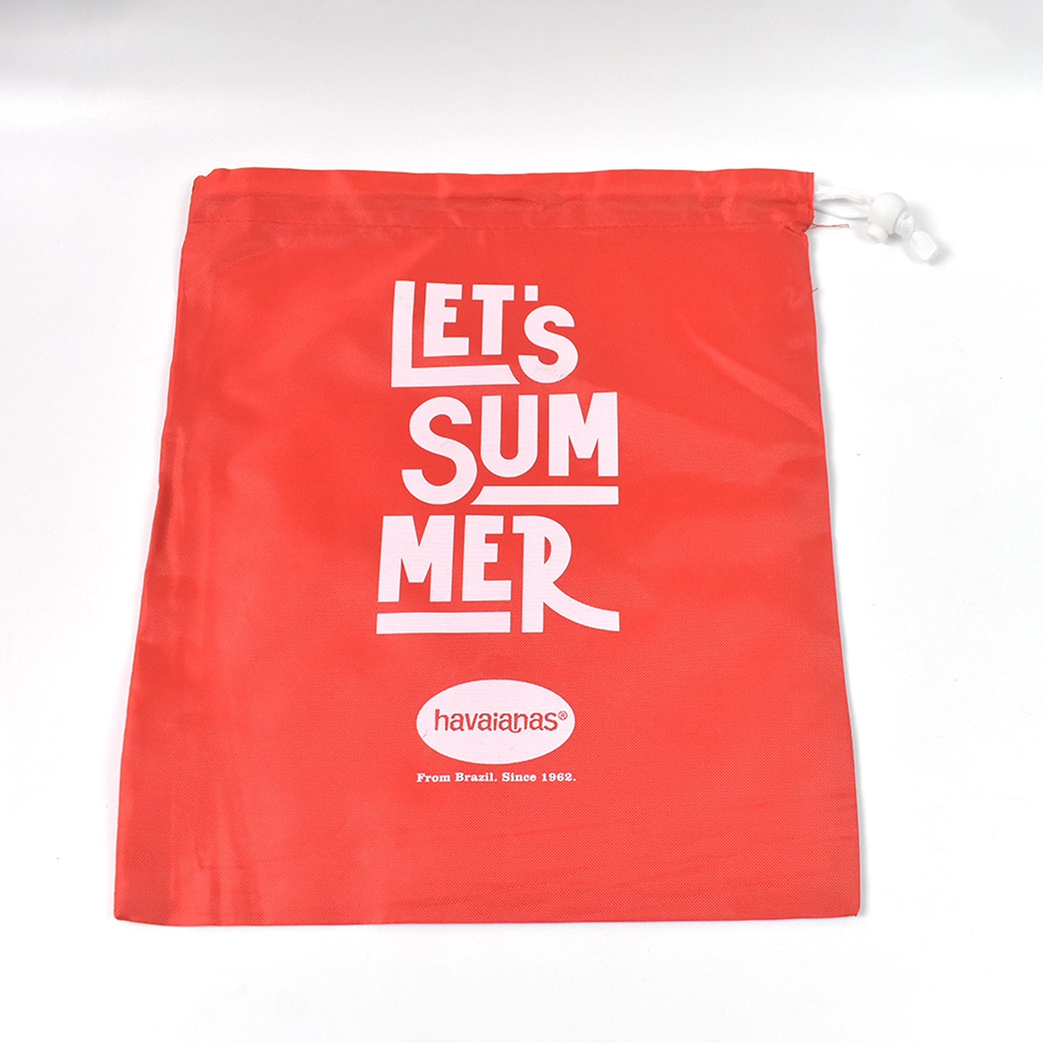 Bright red heavy duty drawstring bag with 'Let's Summer' slogan for versatile storage