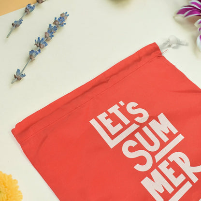 Heavy duty drawstring bag in red with playful text 'Let's Summer' for durable storage and travel