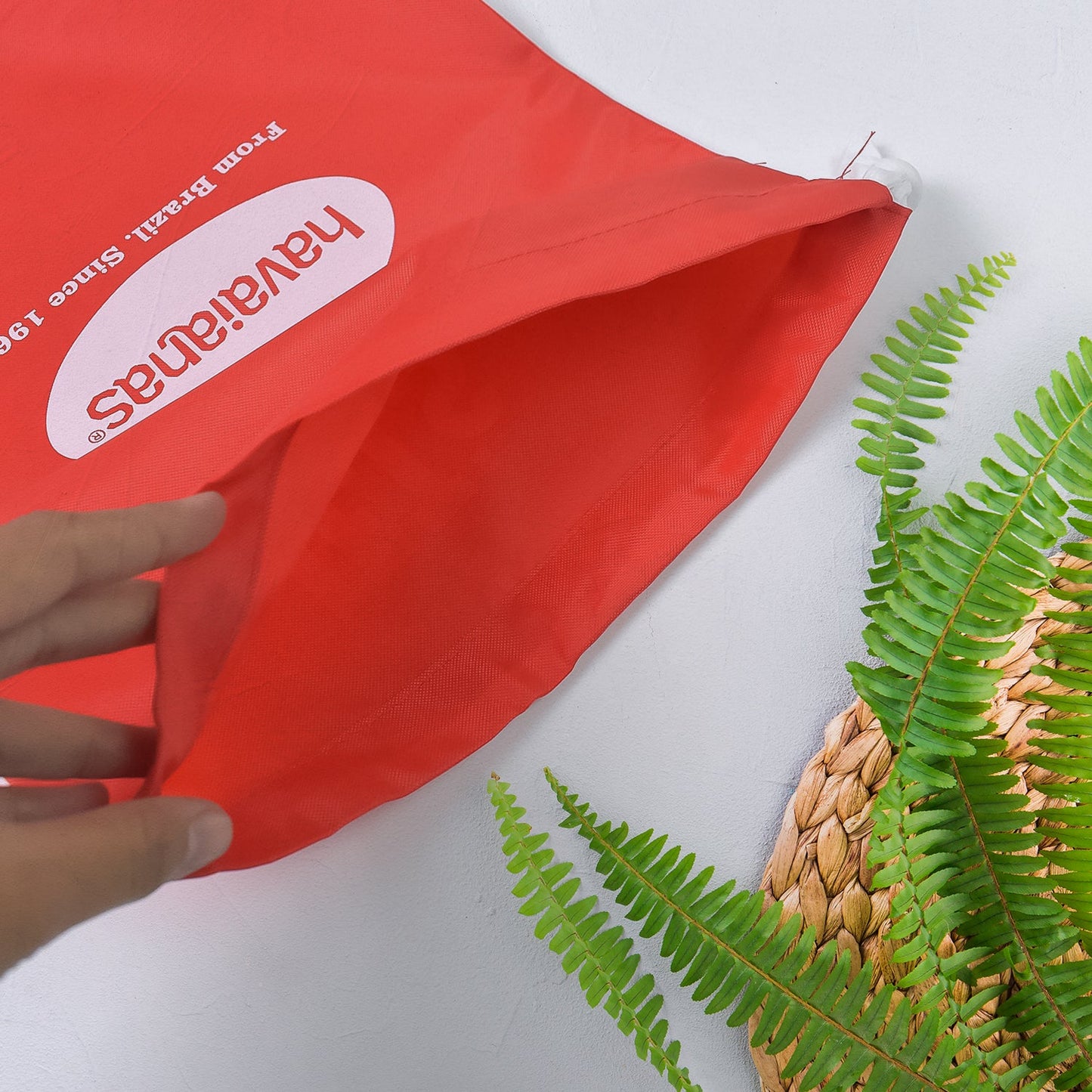 Heavy duty drawstring bag in bright red with durable design for home improvement and organization