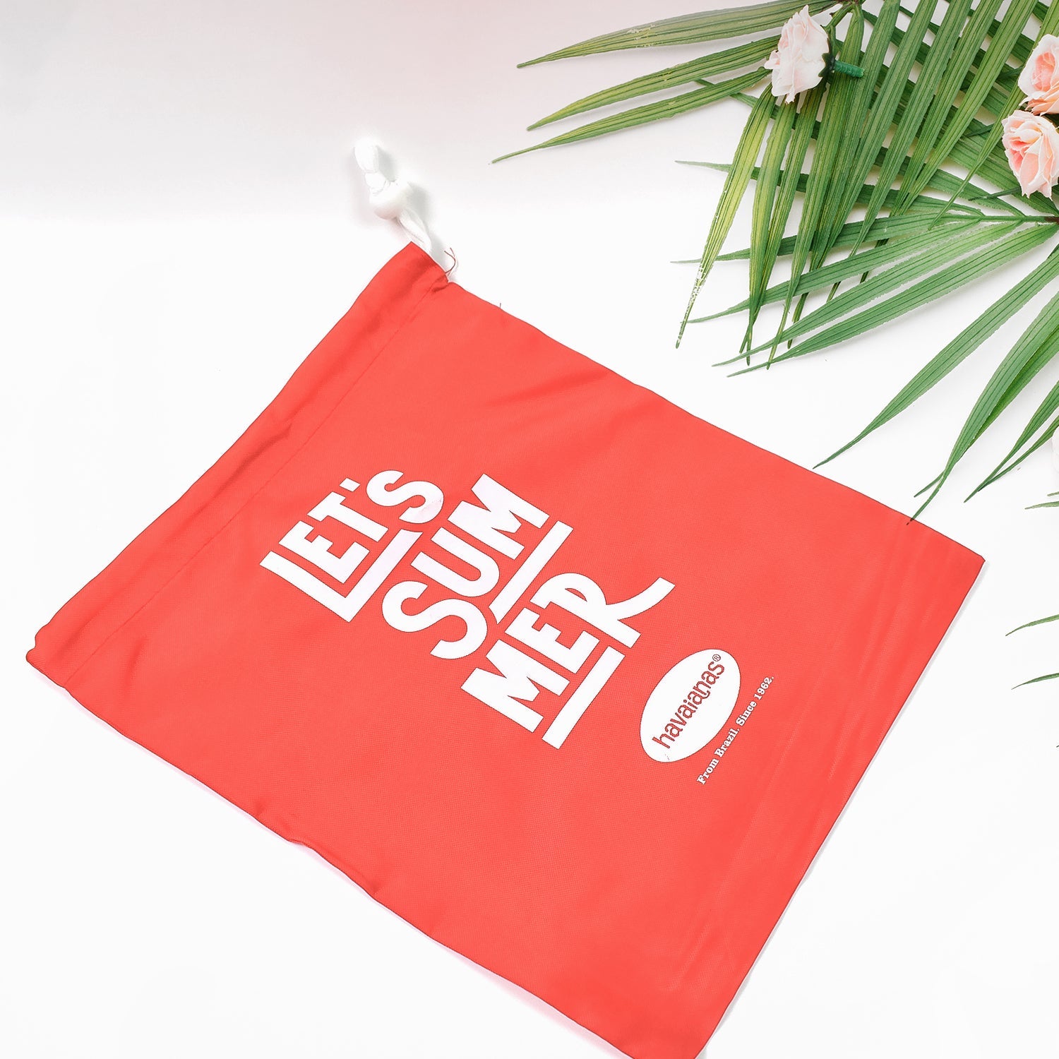 Bright red heavy duty drawstring bag featuring a fun summer design, perfect for beach outings