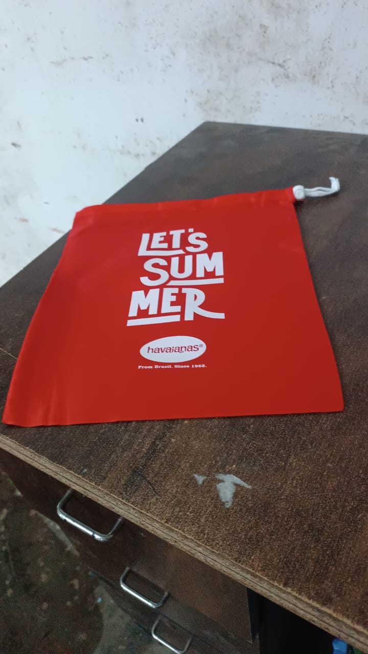 Red heavy duty drawstring bag with 'Let's Summer' print, ideal for outdoor activities