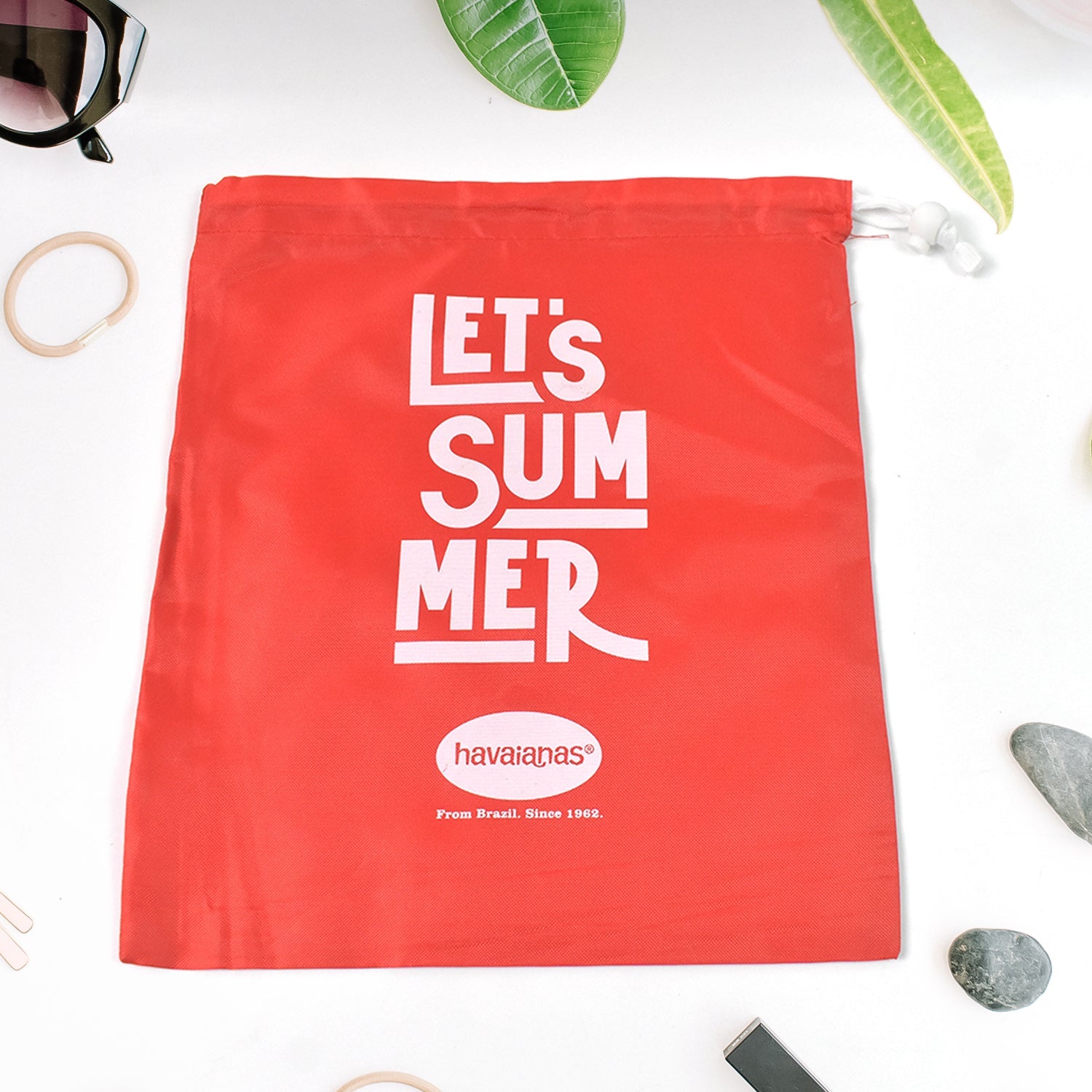 Bright red heavy duty drawstring bag with summer slogan for versatile storage and transport