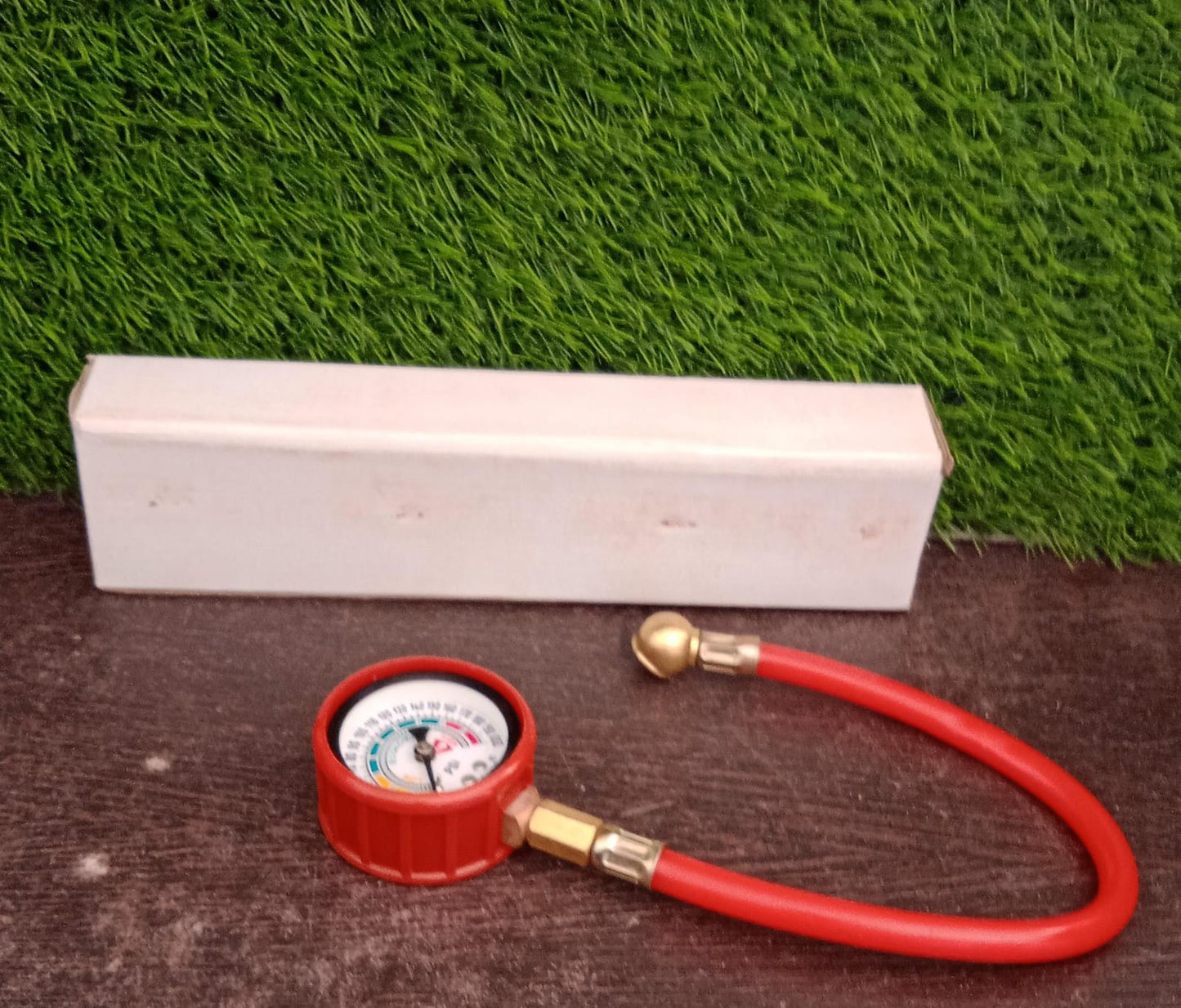 Your Brand heavy duty tire inflator gauge with a red hose and pressure dial for accurate readings