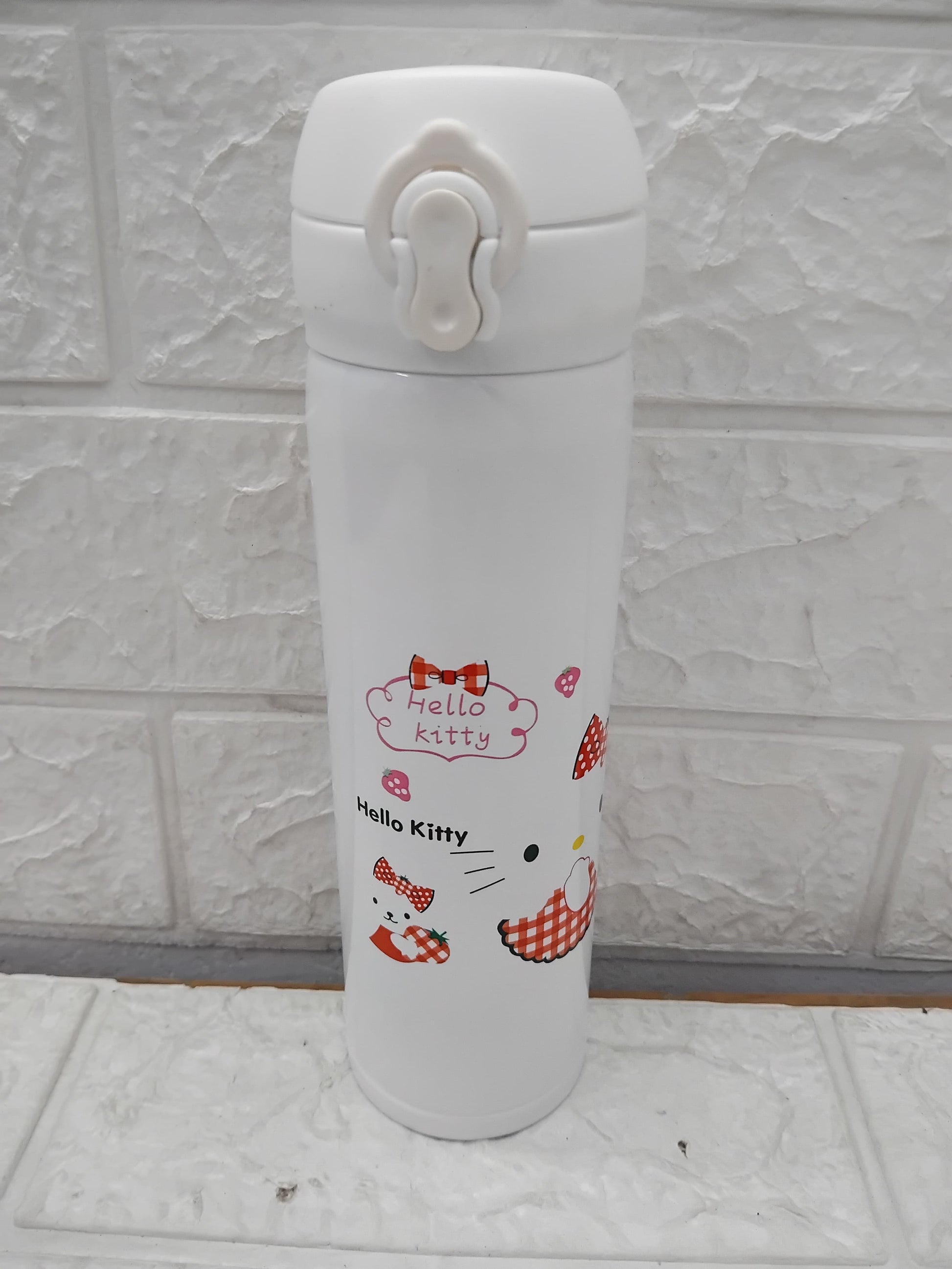White SS insulated water bottle for kids 500ml with Hello Kitty design and secure flip-top lid