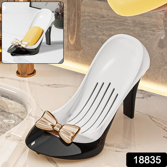 Stylish high heel soap holder in black and white with a decorative bow for elegant bathroom decor