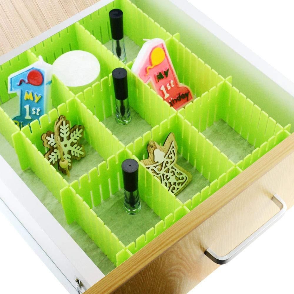 Green modular grid of adjustable drawer organizer dividers in a wooden drawer holding nail polish and small trinkets