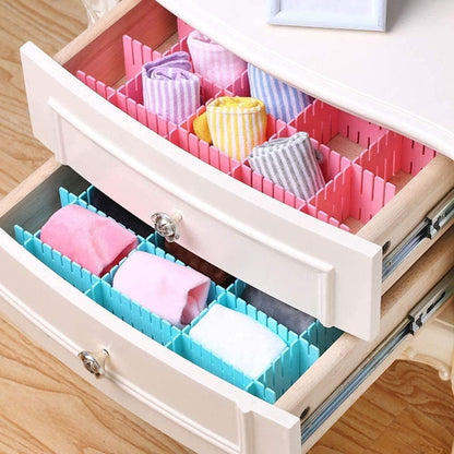 Dresser drawers with pink and teal adjustable drawer organizer dividers holding rolled socks and underwear