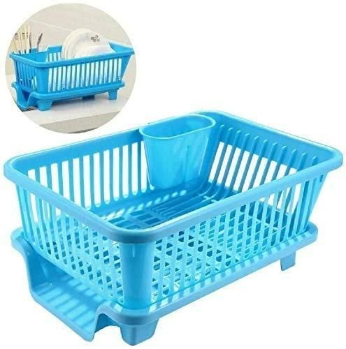 Blue compact plastic dish drainer with cutlery holder on countertop elevated feet and draining spout