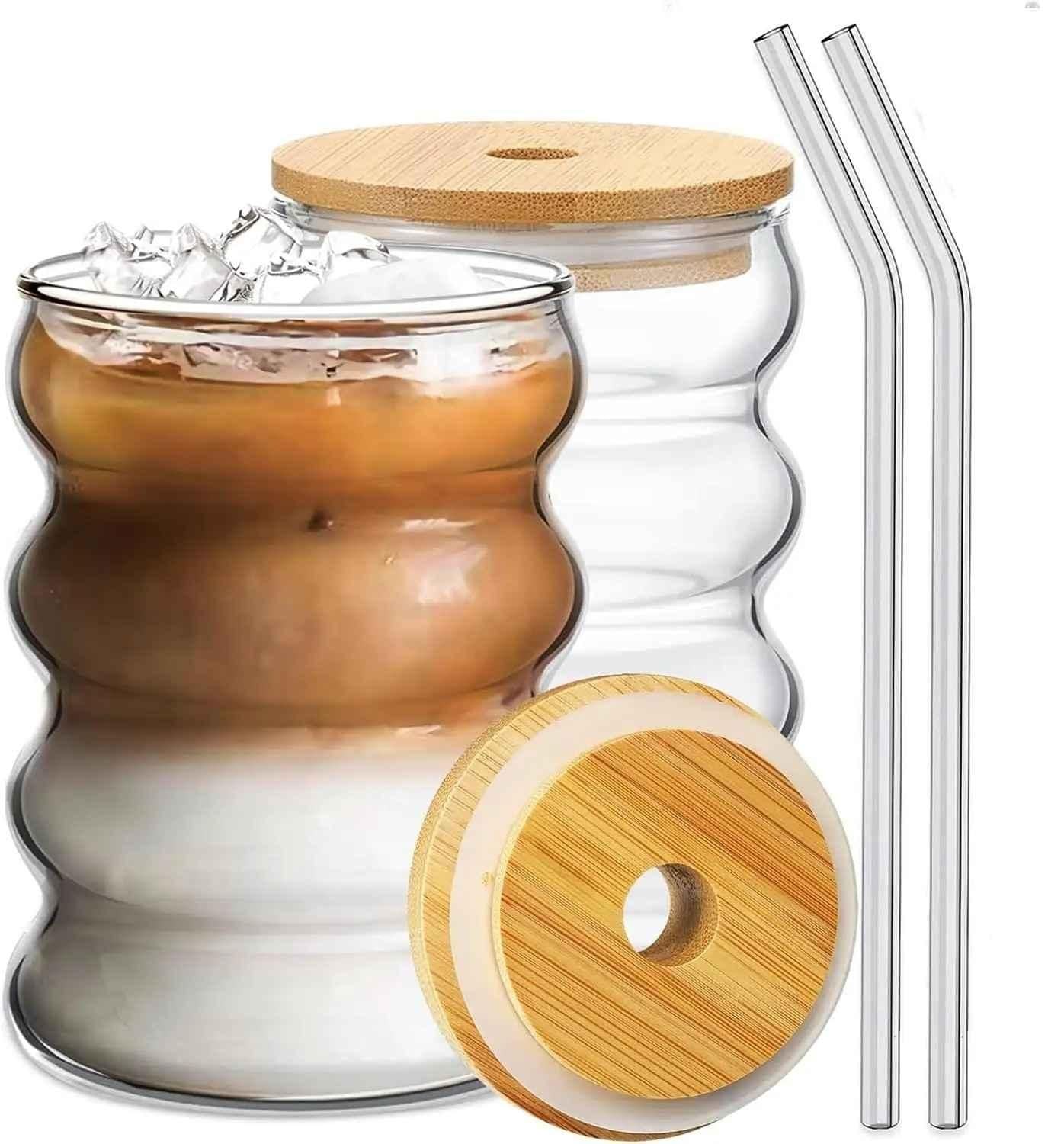Two double wall wave shape glass with wood cap tumblers with bamboo lids and two reusable glass straws