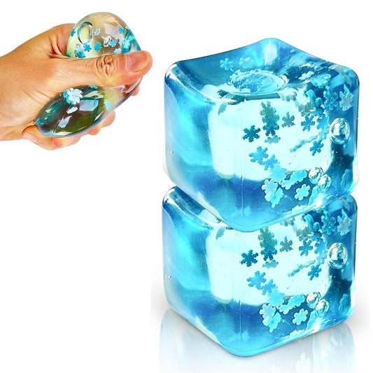 Hand squeezing a blue ice cube stress ball filled with decorations for fun stress relief