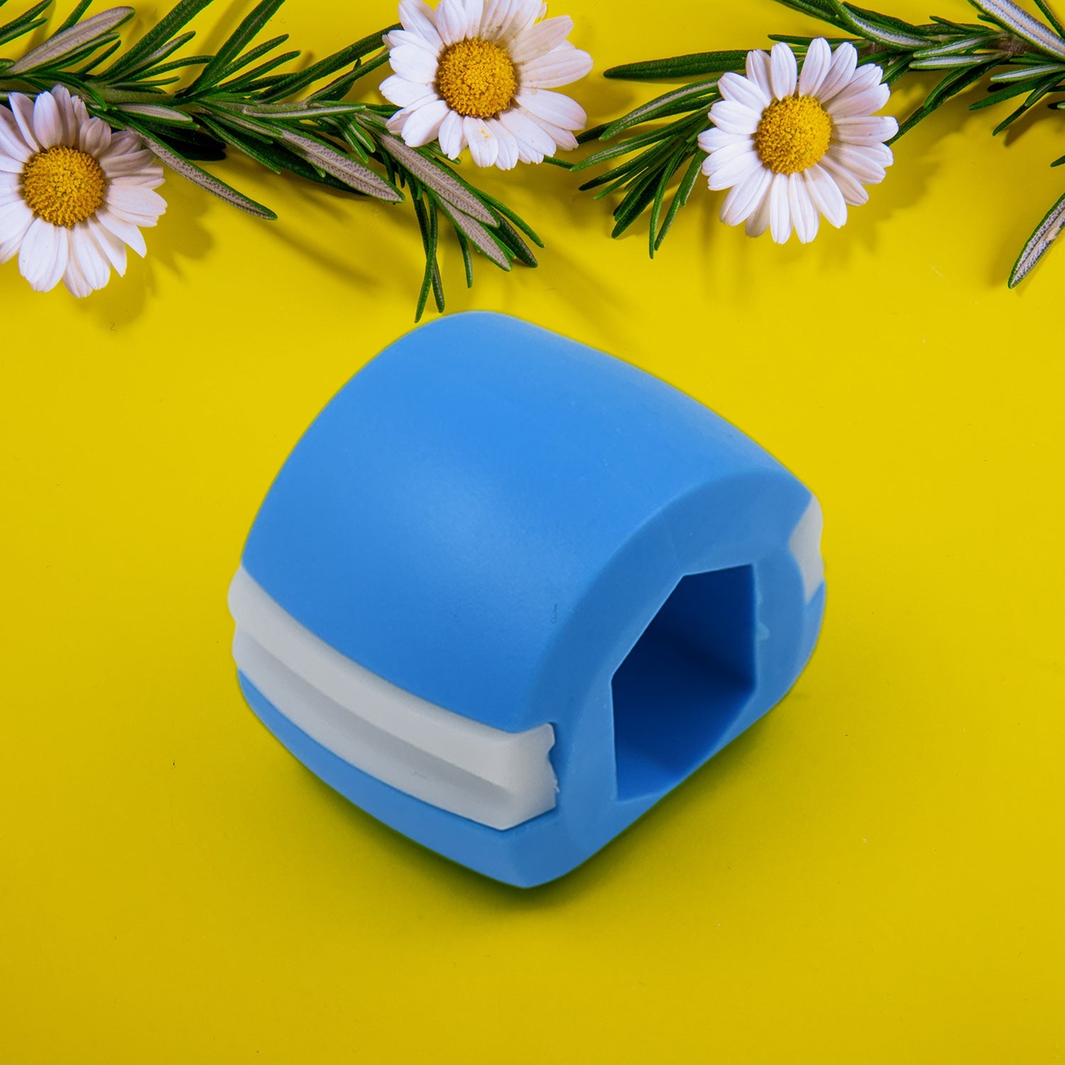 Jaw sculpting tool in blue silicone for facial contouring and skincare routines