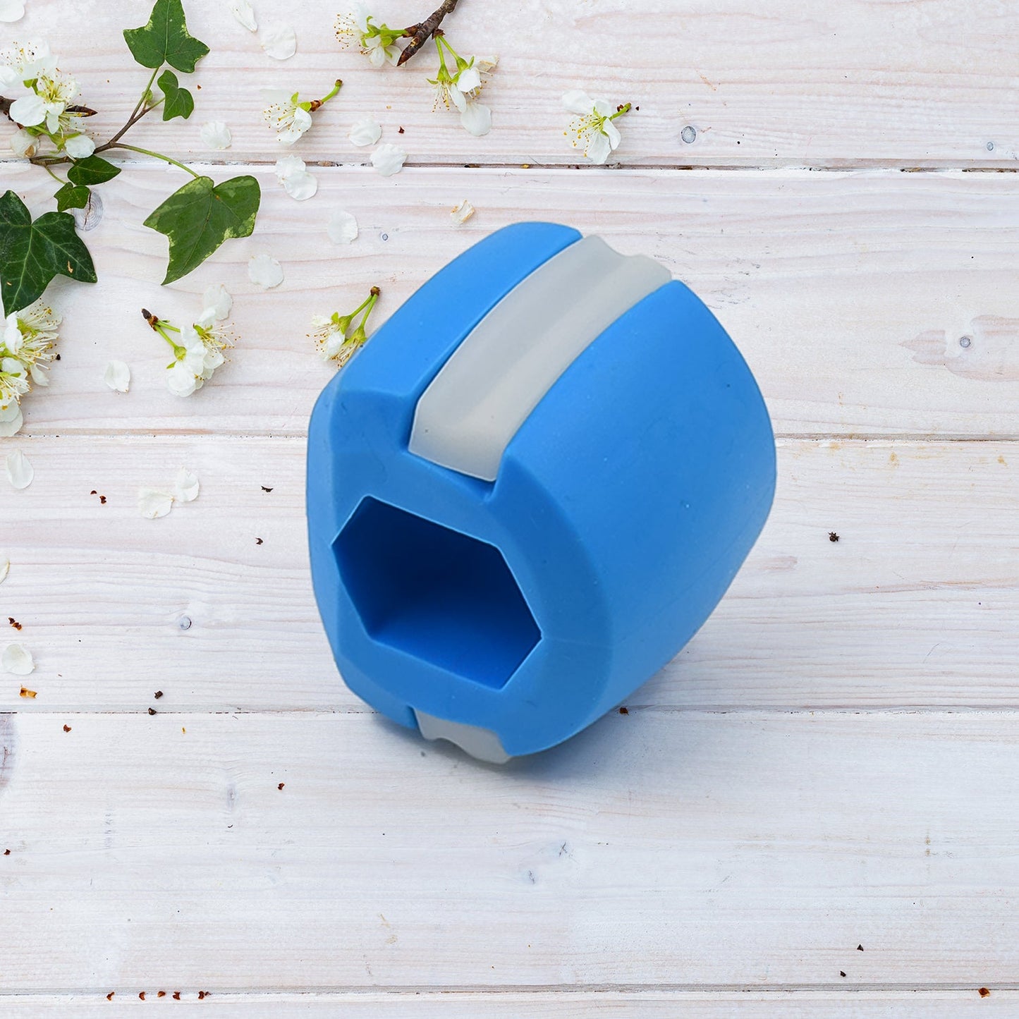 Your Brand jaw sculpting tool in blue silicone, designed for enhancing jawline aesthetics