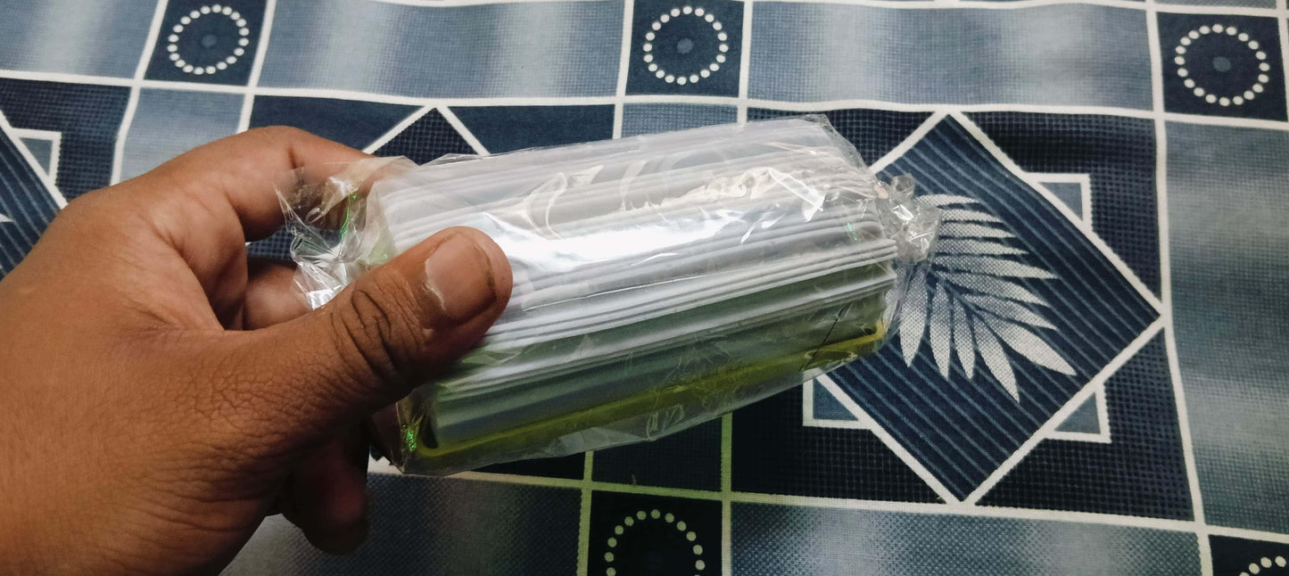 THE GIR FARMER reusable scrubber for kitchen green and white foam pads wrapped in plastic held by hand