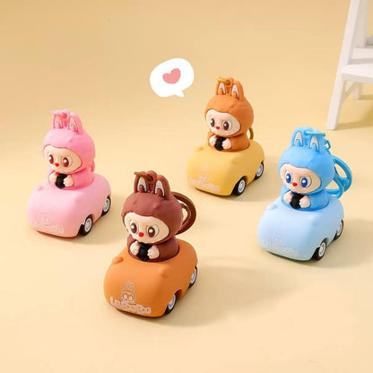 Colorful Labubu car keychain featuring cute characters in pink, blue, brown, and yellow cars