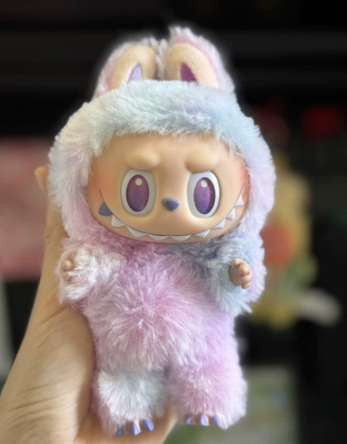 Labubu The Monsters toy for collectors in pastel blue and pink fuzzy costume with large eyes and sharp teeth