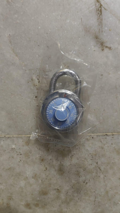 THE GIR FARMER standard dial combination lock with blue dial encased in plastic packaging