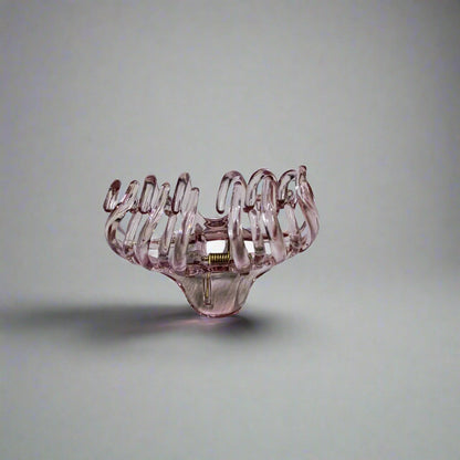 Large claw clip for thick hair in transparent pink plastic design