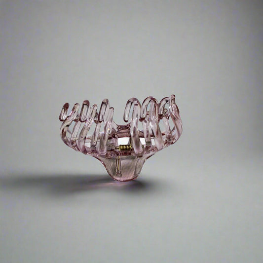 Large claw clip for thick hair in transparent pink plastic design
