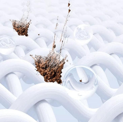 Closeup of white woven fabric with dirt splashes and water droplets showing cleaning action of color bleach laundry detergent
