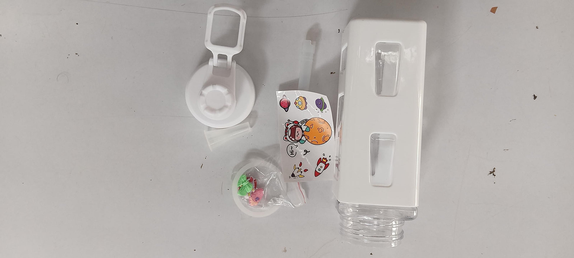 THE GIR FARMER leakproof kawaii bottle with lid in white with cartoon stickers and silicone seal