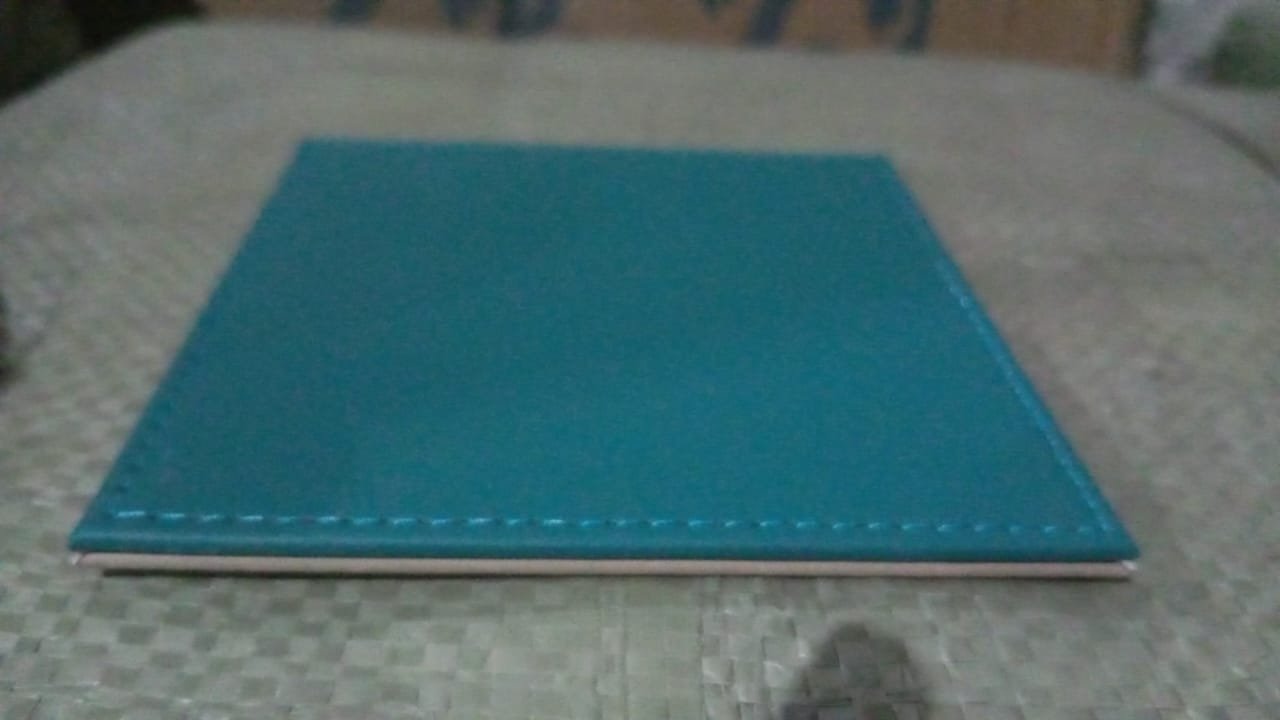 Elegant turquoise leather tea coaster with a sleek design for home and kitchen use